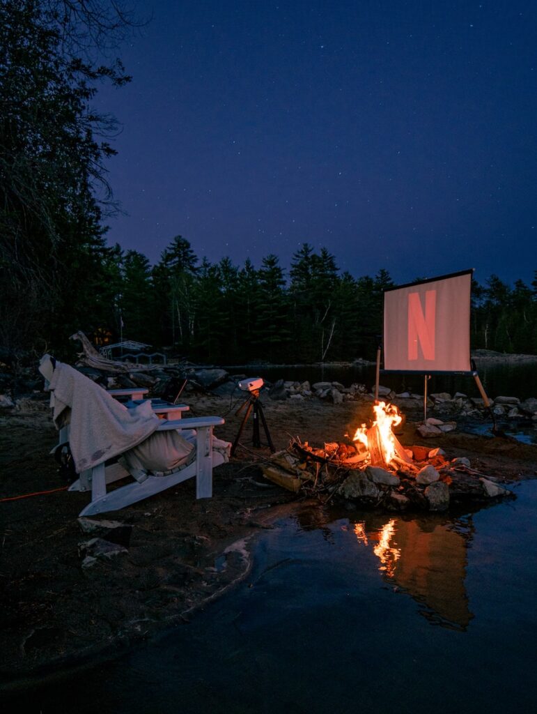 easy date night idea of bonfire near body of water during night time
