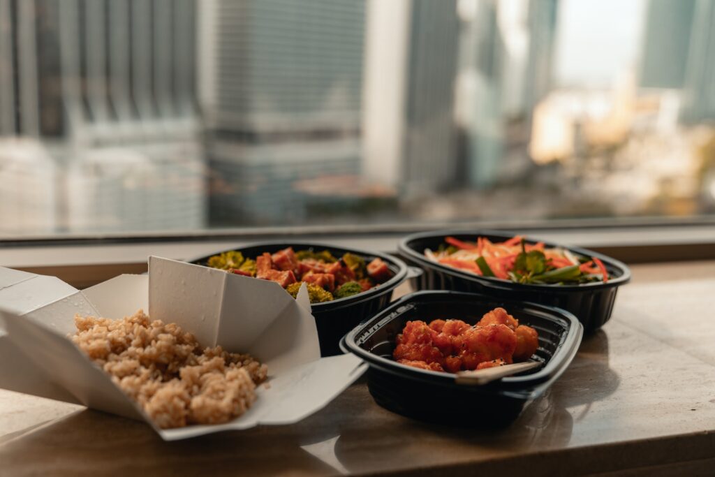 Close-Up Photo Of Food On Wooden Table takeout to combat food waste