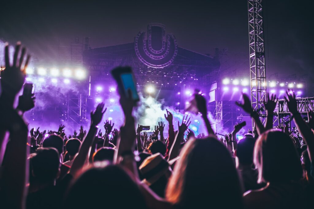 sustainable event ideas showing a group of people raising their hands in concert