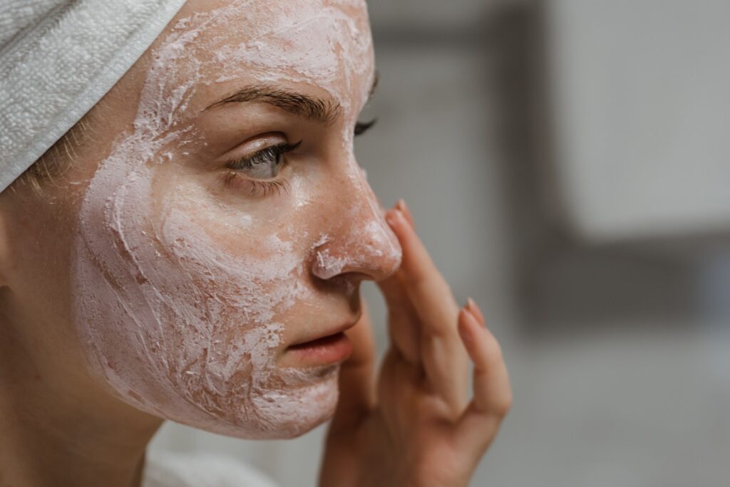 Close-up Photo of a Woman Applying Facial Cream concerned about toxic skincare ingredients