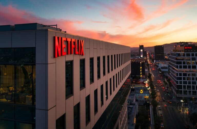 netflix sustainability white and black concrete building during night time