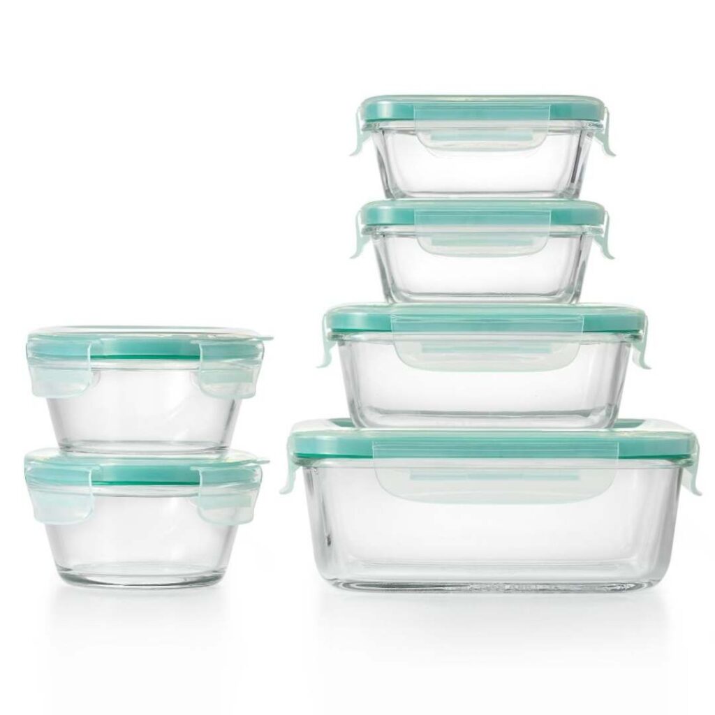 glass storage containers in different sizes with aqua colored bordered plastic lids