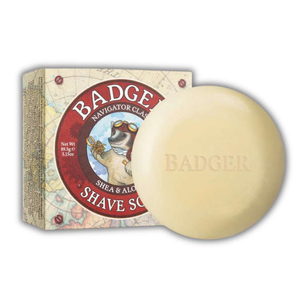 badger zero waste shaving cream soap bar. round with box behind it that says badger shave soap with shea and aloe